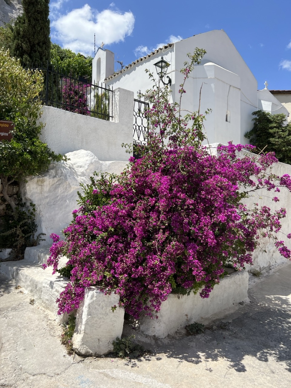 A small church with a bougainvillea in Naxos, Greece