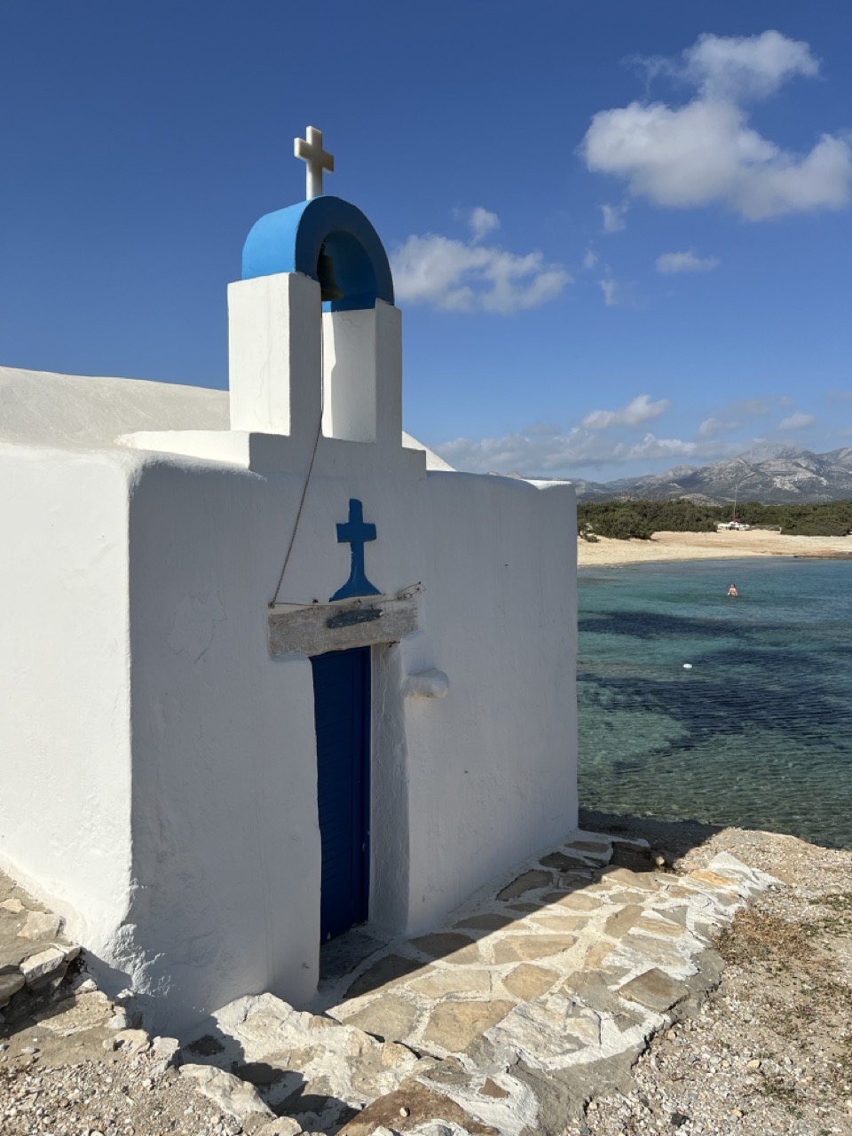 A tiny white and blue church in Naxos, Greece